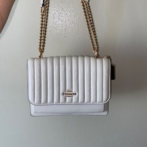 Cream colored coach purse w gold chain